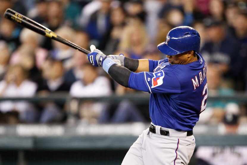 Jun 15, 2014; Seattle, WA, USA; Texas Rangers center fielder Leonys Martin (2) singles...