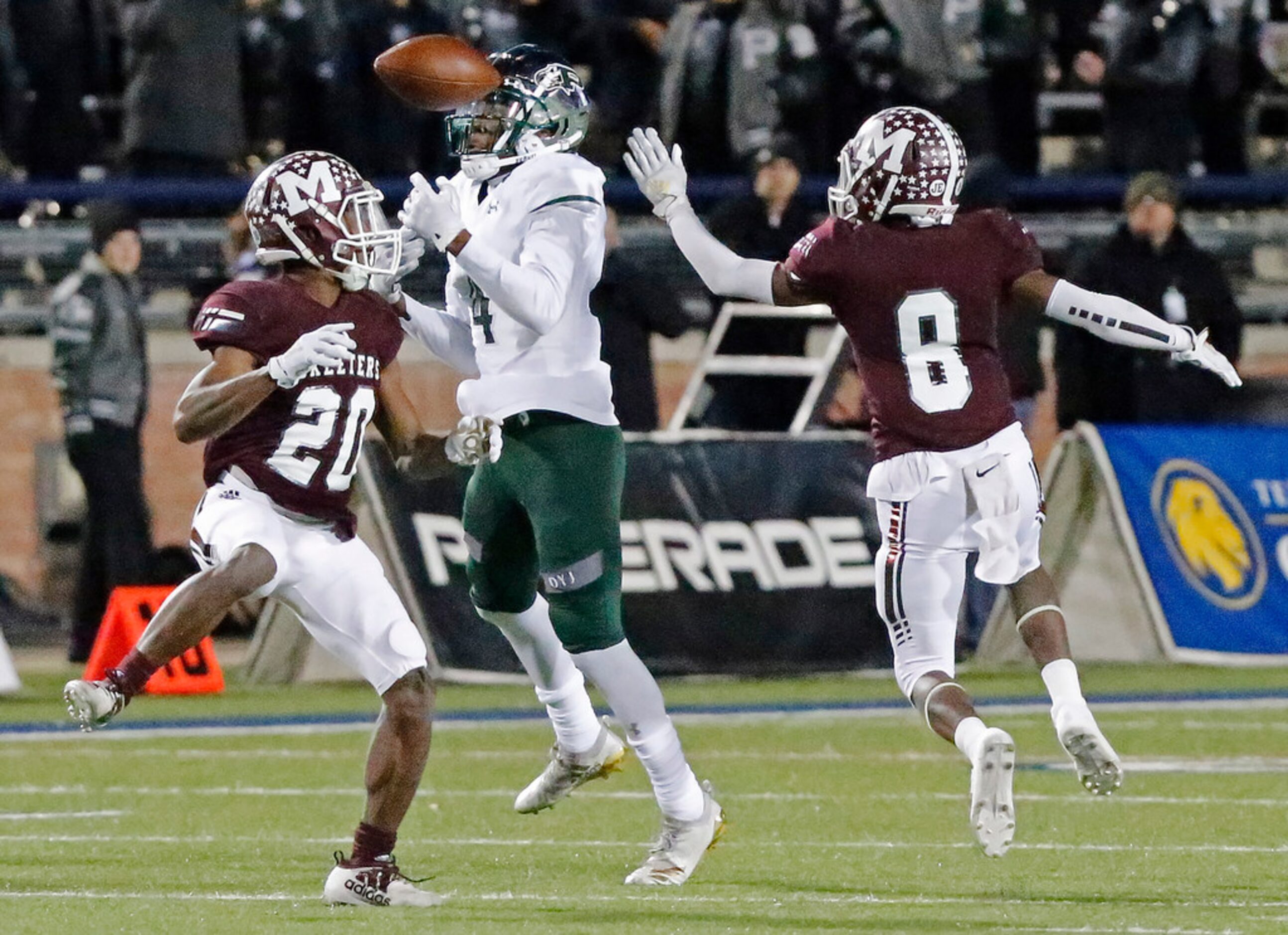 Prosper High School wide receiver Miyor Paschel (4) came up with this pass between Mesquite...