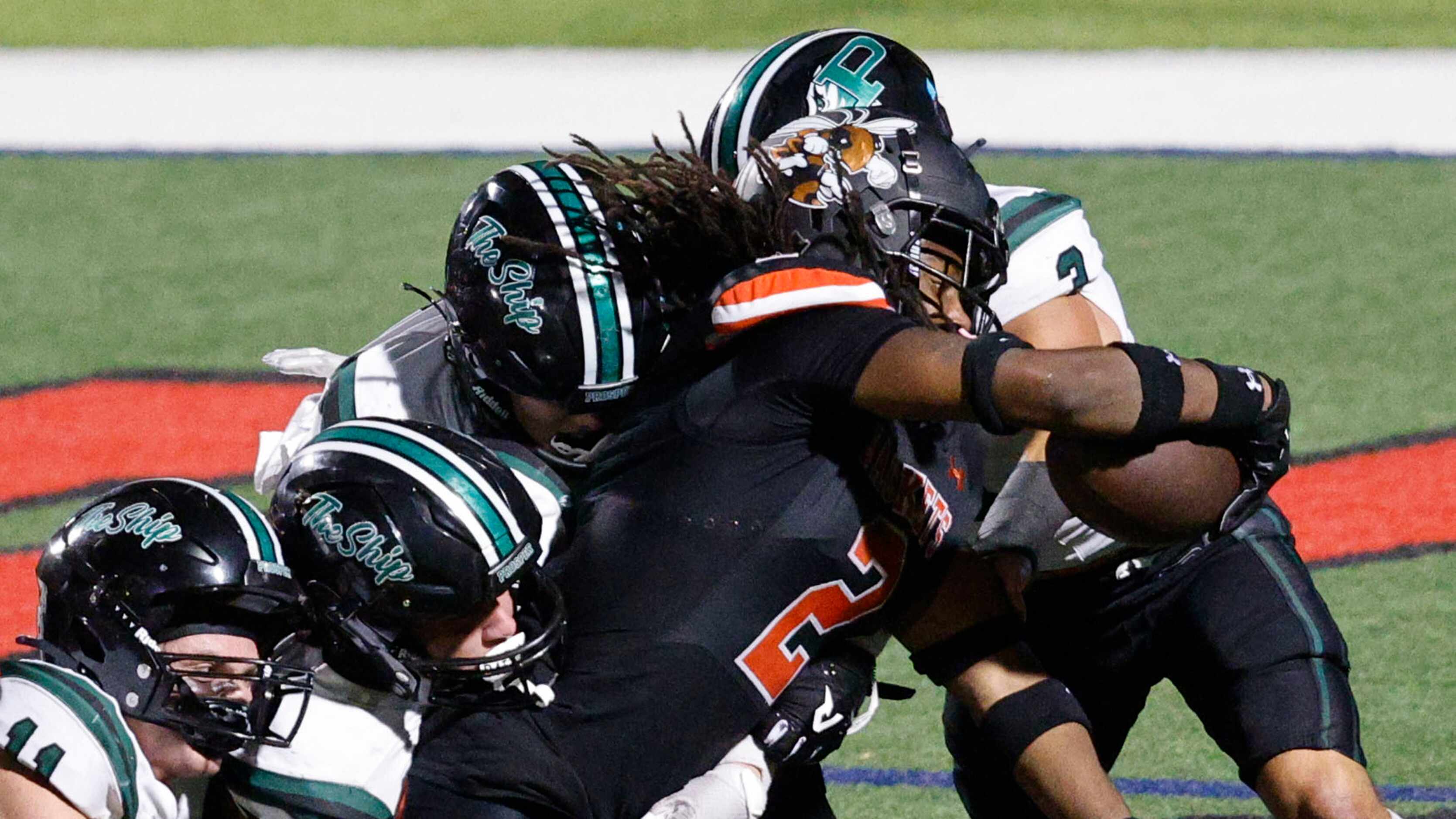 Rockwall's Ashten Emory (2) scores a touchdown over Prosper during the second half of a high...