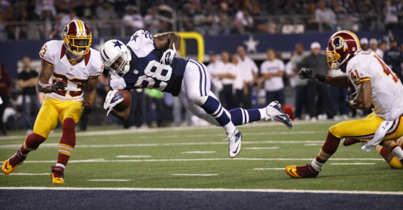 Dallas Cowboys running back Felix Jones (28) dives for the end zone, scoring a fourth...