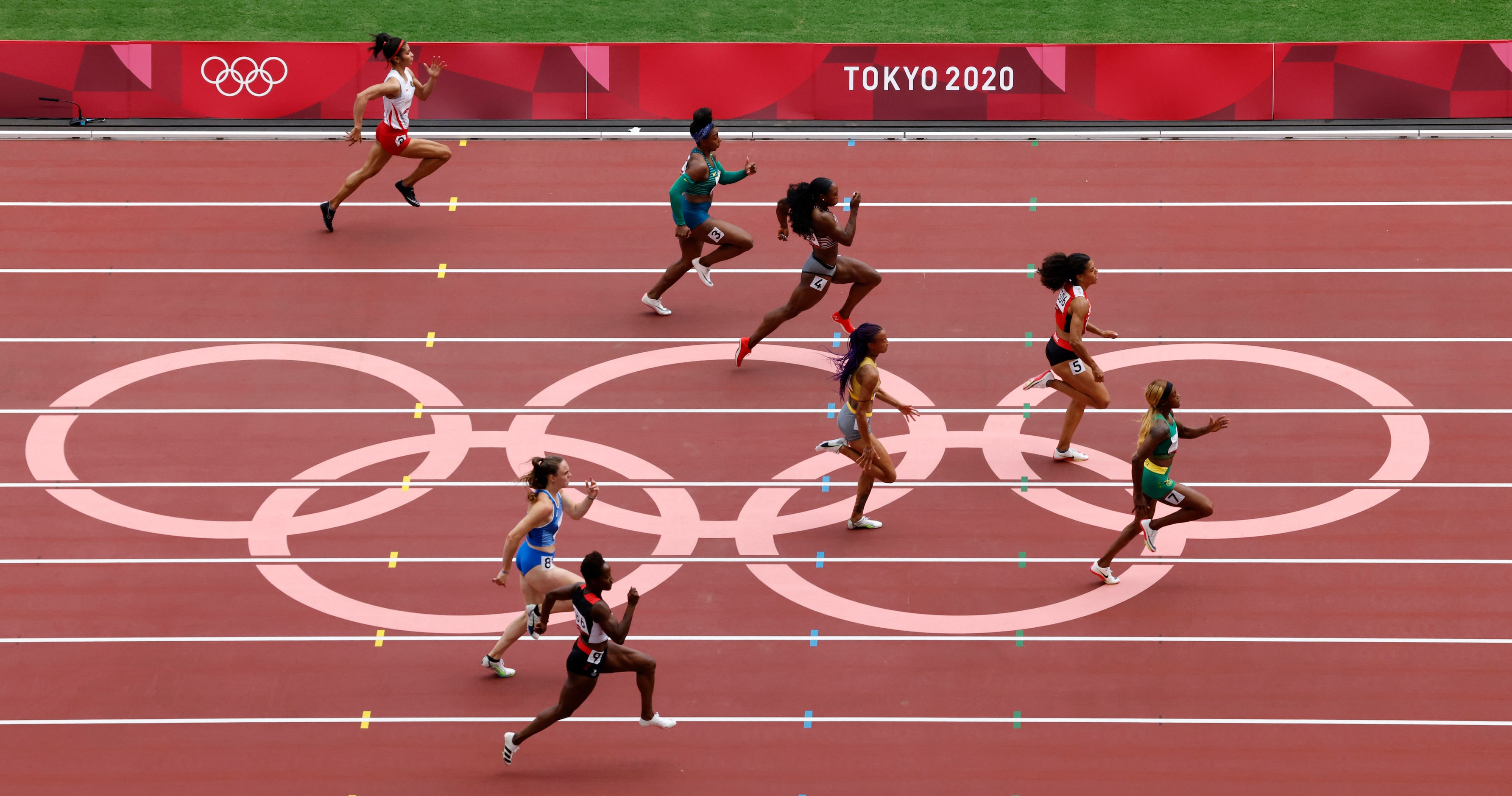 Jamaica’s Elaine Thompson-Herah takes the lead in a women’s 100 meter race during the...