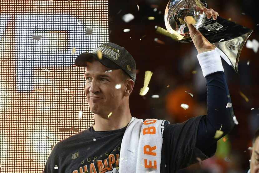 Peyton Manning of the Denver Broncos celebrates with the Vince Lombardi Trophy after Super...