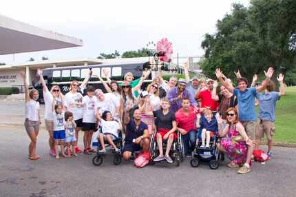 Kidd Kraddick (far right) poses with families who have been helped by his Kidd's Kids...