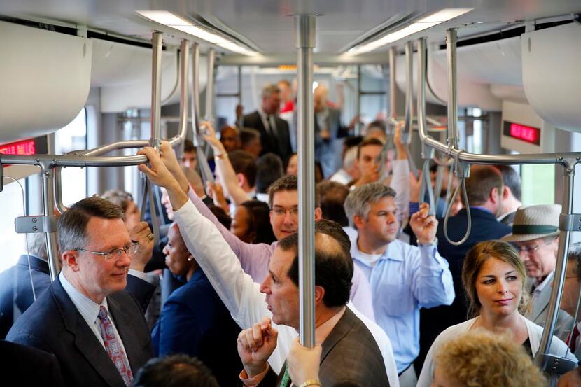 
On the streetcar’s initial run, Dallas Area Rapid Transit CEO Gary Thomas (left) visited...