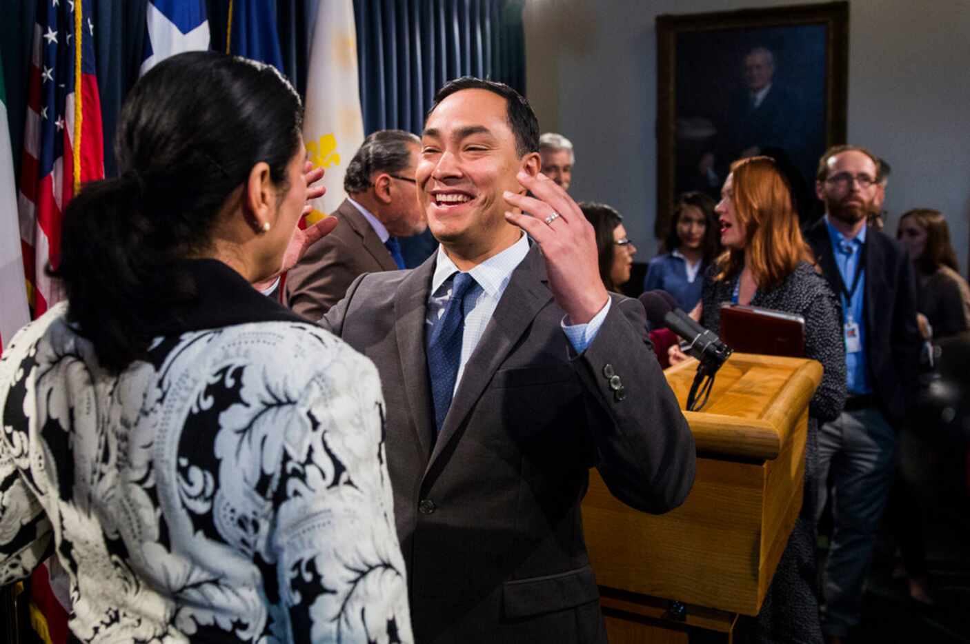 U.S. Congressman Joaquin Castro, center, talks with Texas State Sen. Carol Alvarado after a...