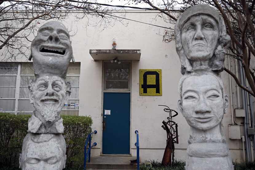 Stone heads frame the main entrance to the Creative Arts Center of Dallas Thursday, December...