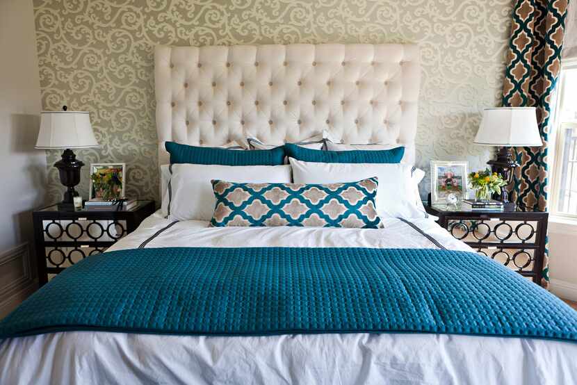 When going with bold patterns in other areas of the room, simple, classic options on the bed...