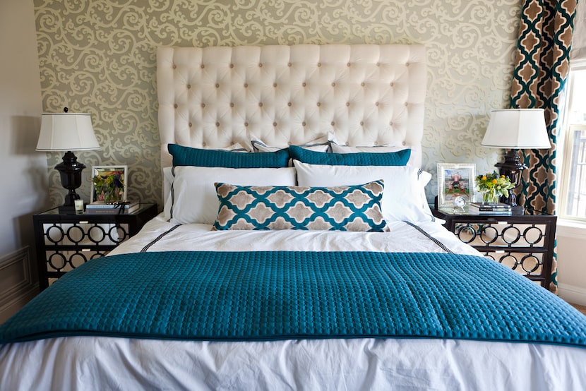 When going with bold patterns in other areas of the room, simple, classic options on the bed...