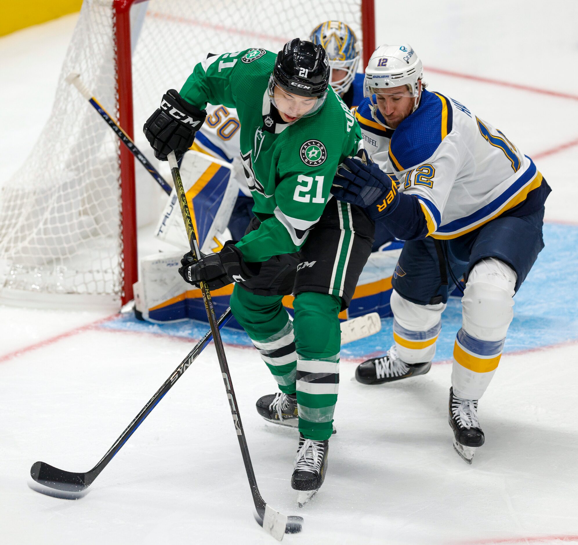 Dallas Stars left wing Jason Robertson (21) handles the puck near St. Louis Blues center...