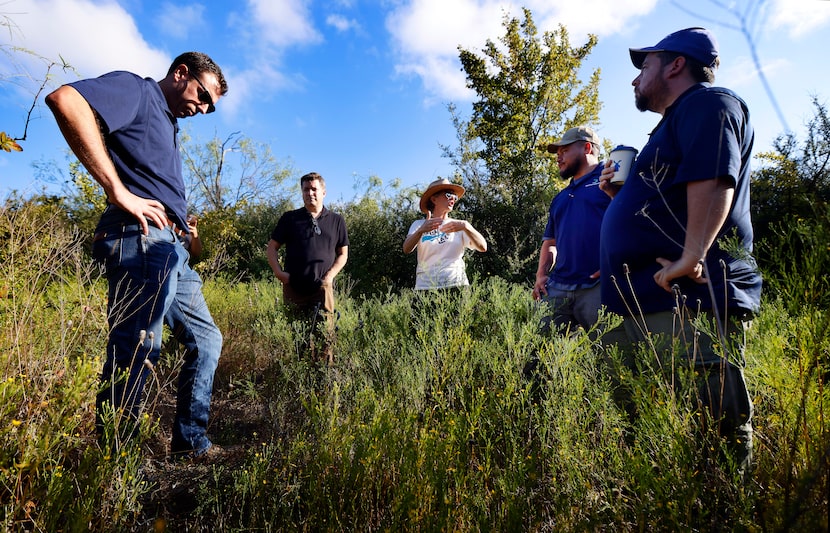 Friends of Bachman Lake president Susanna Brown (center with straw hat) and communications...