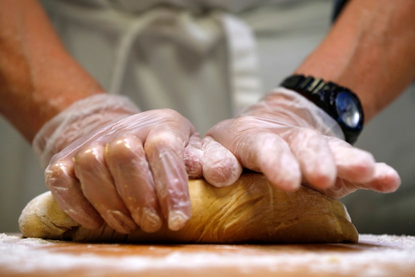 Dotty Griffith kneads dough for tortillas