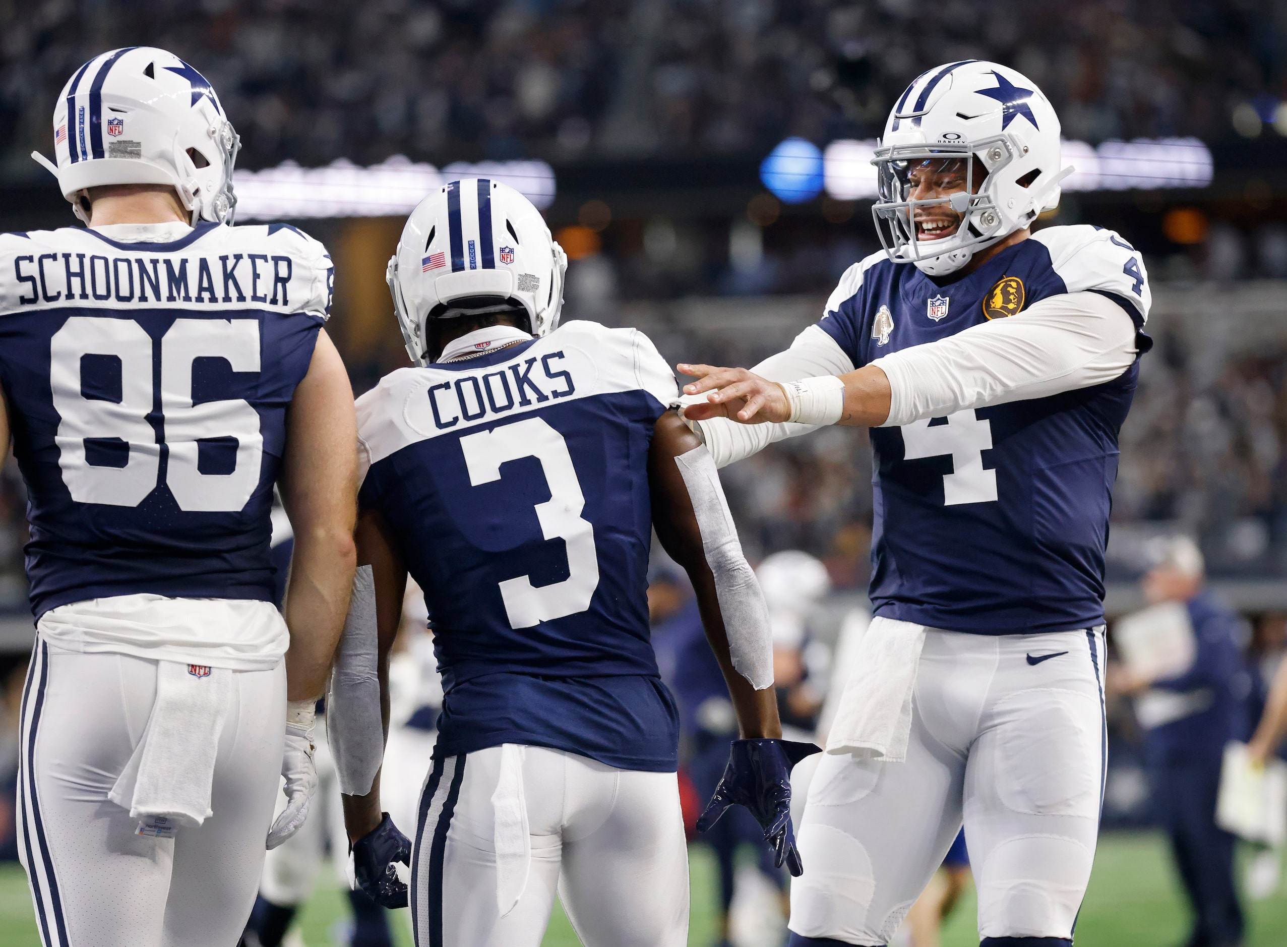 Dallas Cowboys quarterback Dak Prescott (4) congratulates wide receiver Brandin Cooks (3)...