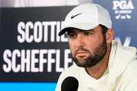 FILE - Scottie Scheffler speaks during a news conference during the PGA Championship golf...