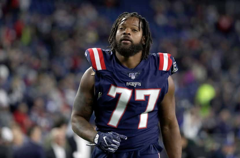 Patriots defensive end Michael Bennett warms up before a game against the New York Giants on...