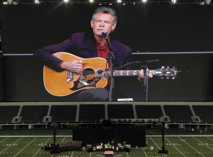 Randy Travis sings Amazing Grace during the Memorial Service for former Navy SEAL Chris Kyle...