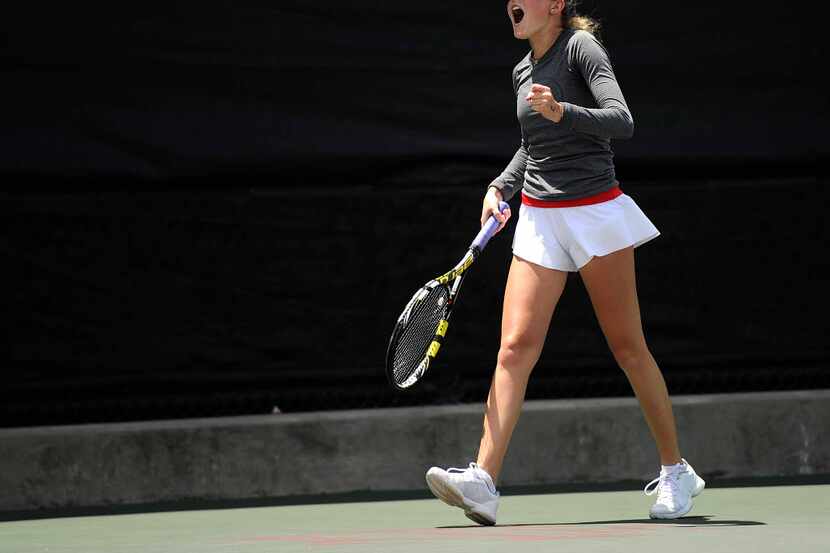 Dallas Hillcrest's Anne Gilliam pumps her fist and screams after winning the final point of...