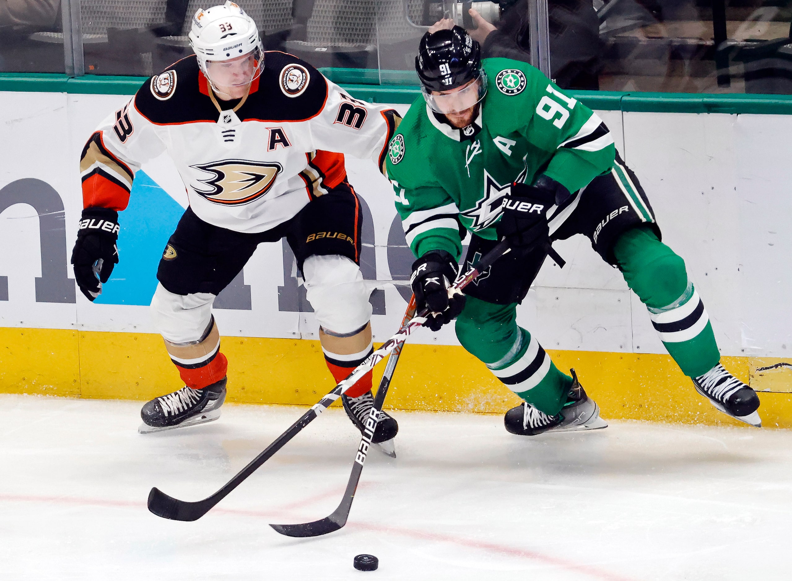 Dallas Stars center Tyler Seguin (91) battles Anaheim Ducks right wing Jakob Silfverberg...