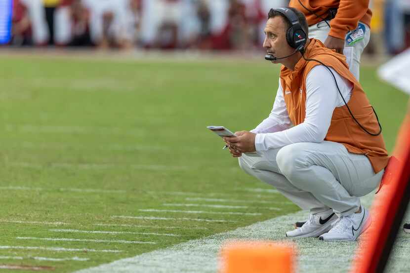 Texas head coach Steve Sarkisian tracks his team from the sidelines during the first half of...