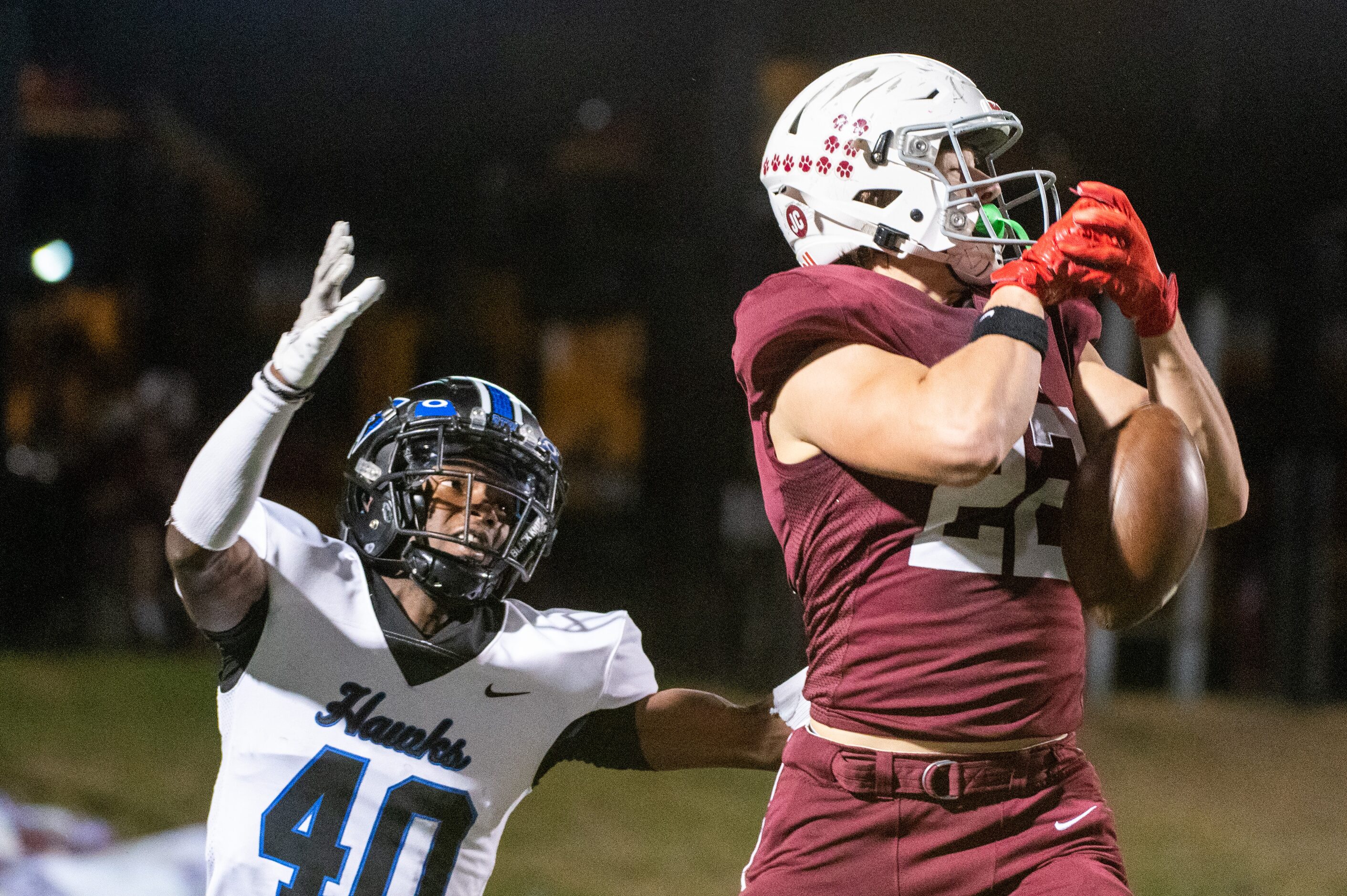 Plano’s Chase Rockenbach (22) can’t hold onto a pass in front of Hebron's Alexander Gilyard...