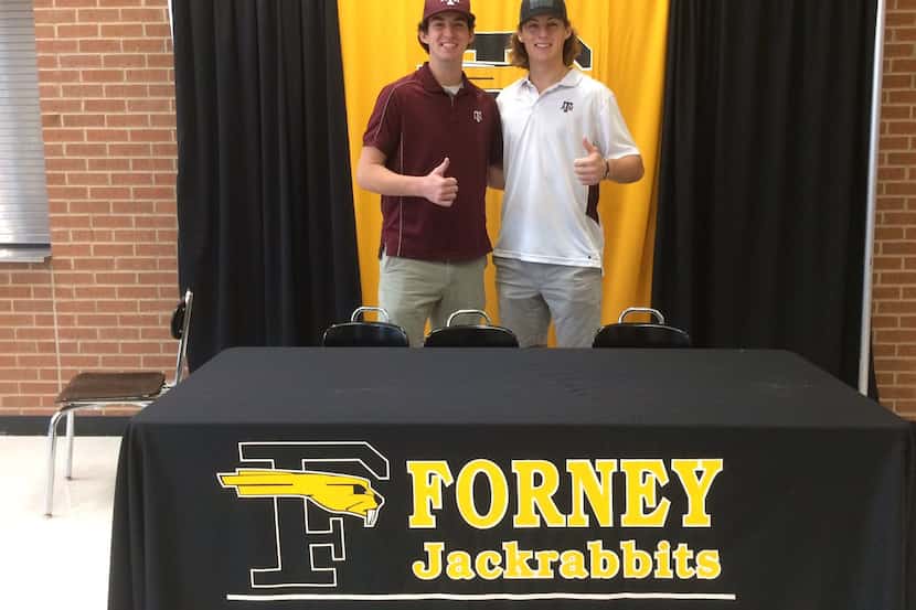 Forney's Jonathan Childress (left) and Mason Englert (right) pose for a photo on signing day...