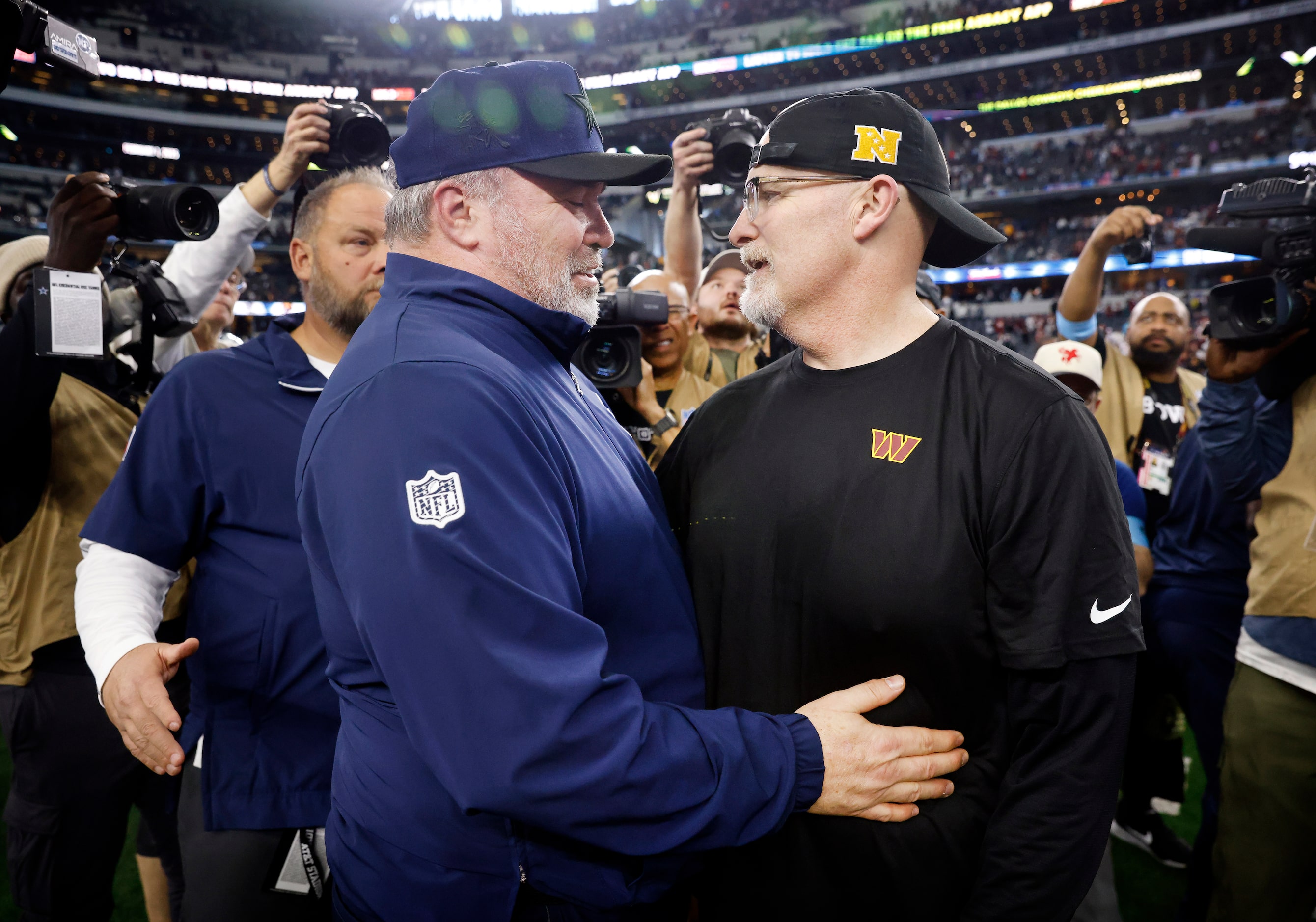 Dallas Cowboys head coach Mike McCarthy (left) greets his former defensive coordinator and...