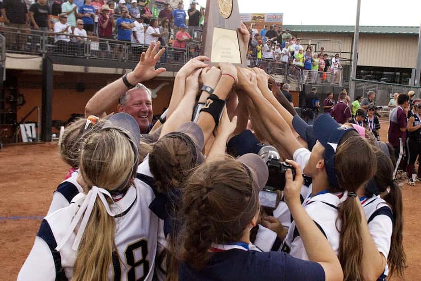 Keller players celebrate their win over Pearland during their UIL State 6A Softball...