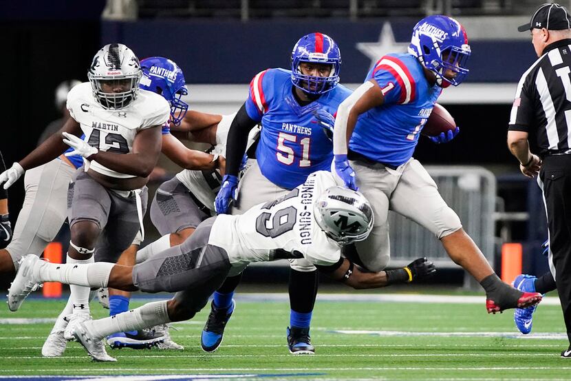 Duncanville running back Trysten Smith (1) tries to get past Arlington Martin defensive back...