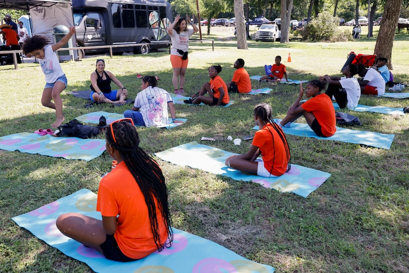 Ayla Hawley (top center) teaches a yoga class for children during The Kill'n Ain't Cool Love...