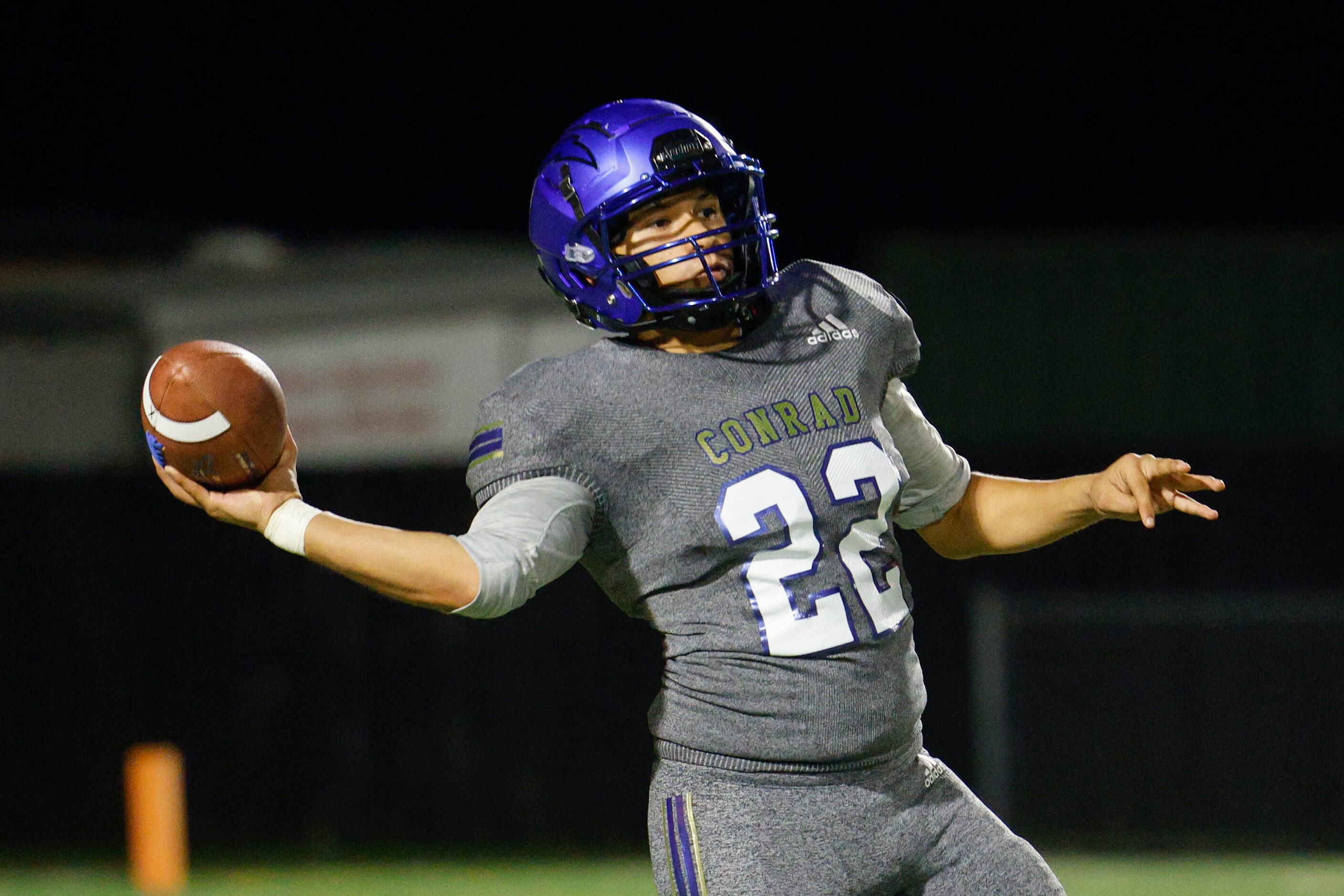 Conrad quarterback Brandon Nieto (22) drops back to pass during the first half of a game...