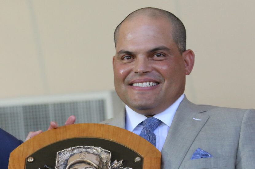 Former Texas Rangers catcher Ivan "Pudge" Rodriguez holds his hall of fame plaque during the...