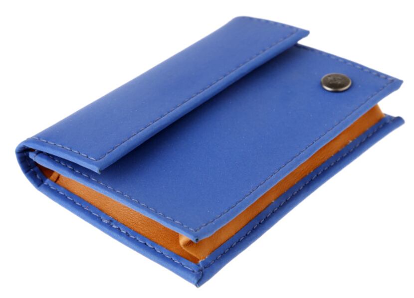 Card carrying: A Cole Haan reflective card case holds cash, business cards or credit cards....