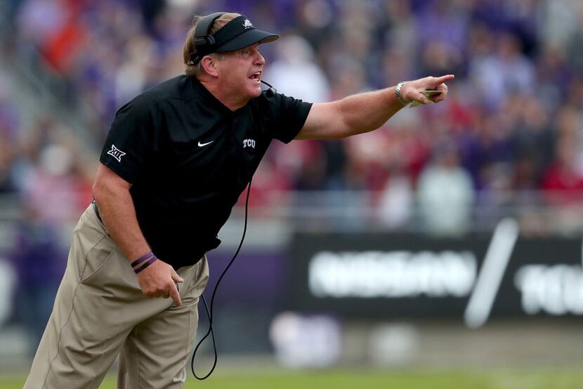 Head coach Gary Patterson of the TCU Horned Frogs heads his team against the Oklahoma...
