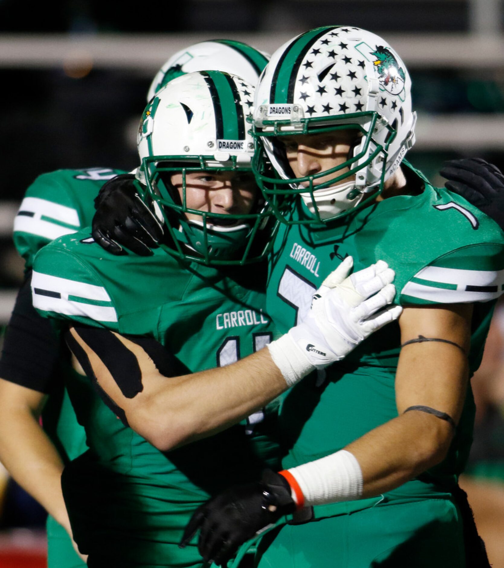 Southlake Carroll running back T.J. McDaniel (4), center, celebrates with teammate Hudson...