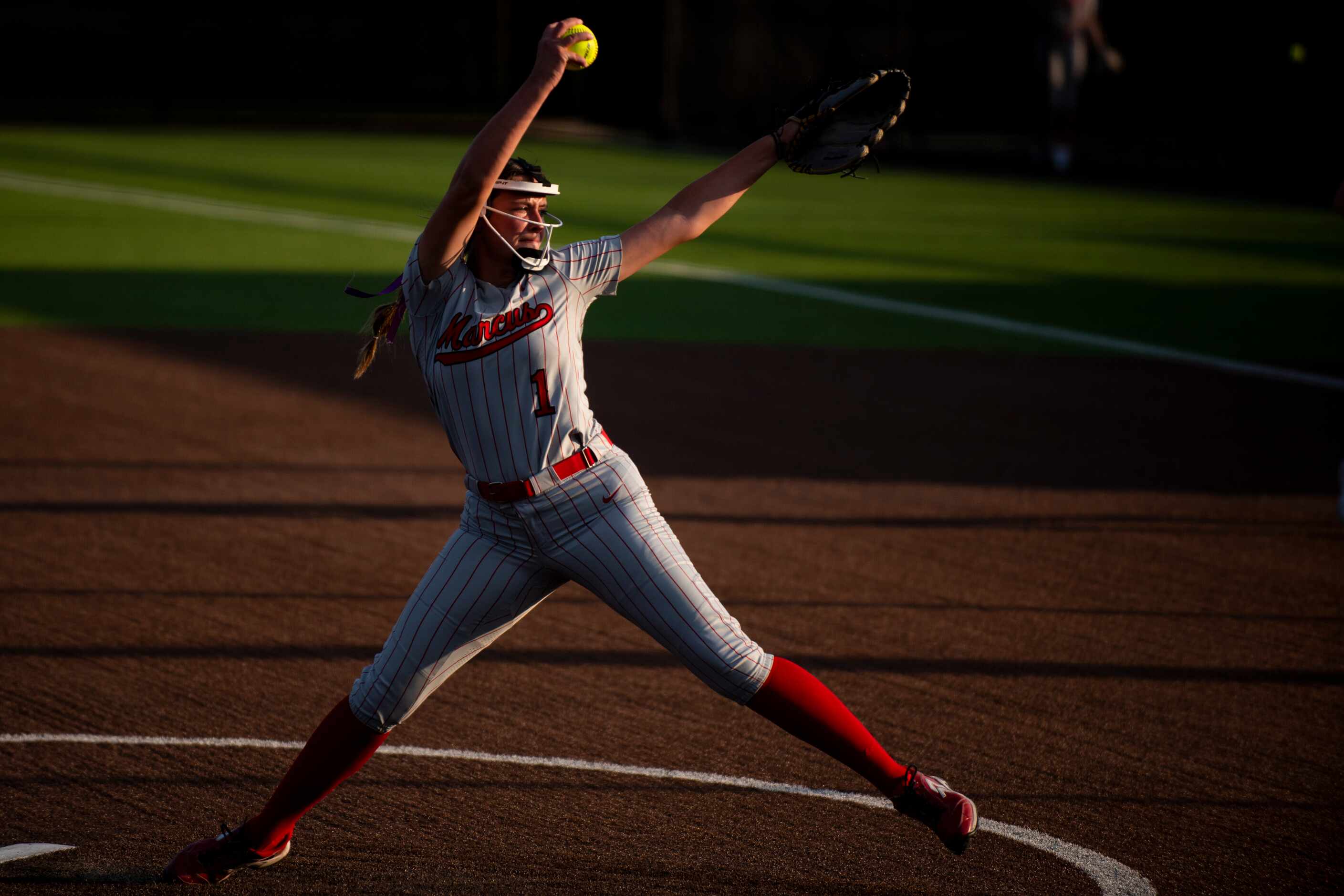 Flower Mound Marcus junior Faith Drissel (1) delivers a pitch during Game One of the Class...