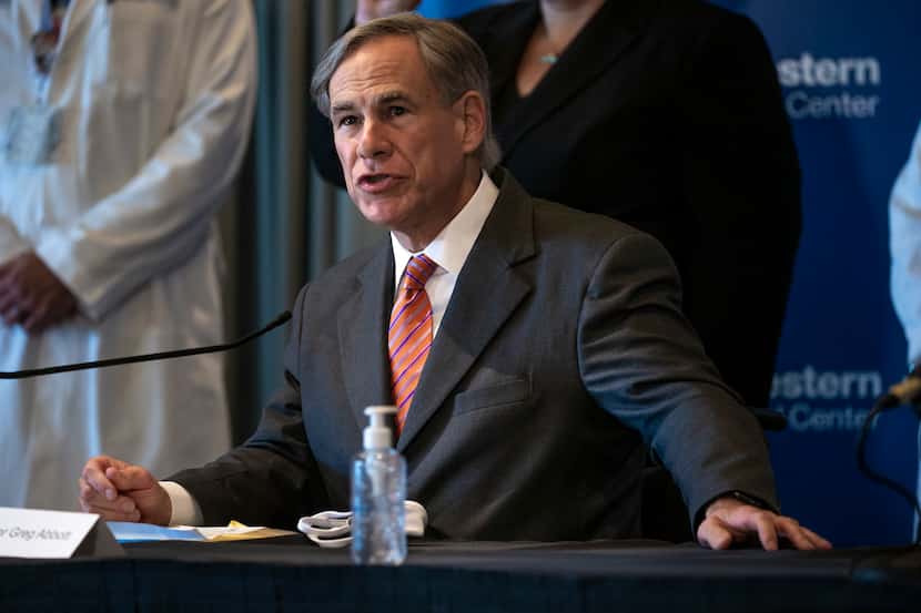 Texas Governor Greg Abbott attended a news conference at the UT Southwestern Medical Center...