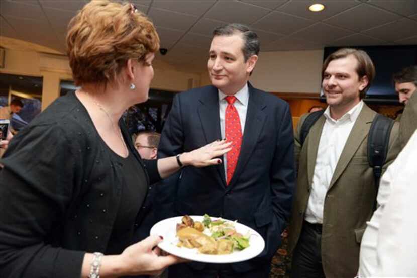  Sen. Ted Cruz chats with New Hampshire Republican Party Chairwoman Jennifer Horn, left, at...
