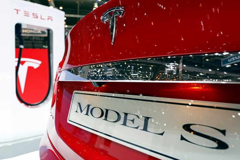 A logo sits on the trunk of a Tesla Model S electric automobile, produced by Tesla Motors...