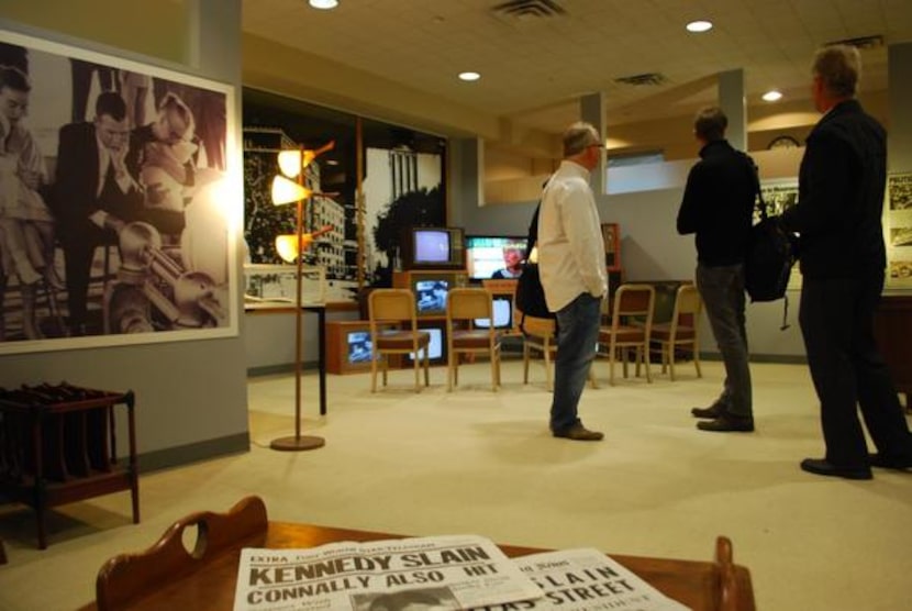 
Irving archivist Kevin Kendro (left) chats with French radio journalists Rémi Sulmont and...