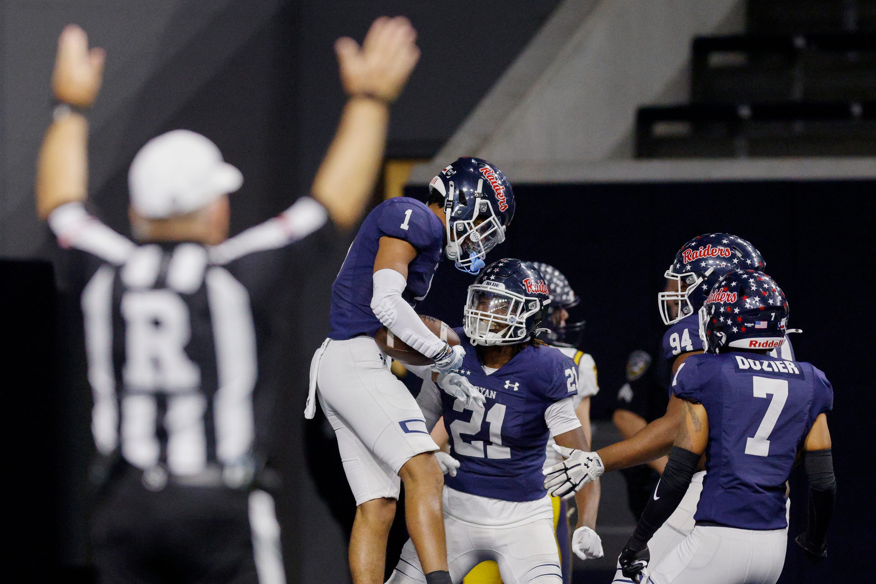 Denton Ryan defensive back Trae Williams (1) celebrates his touchdown with linebacker Dillon...