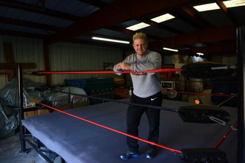 Rob Vaughn,  the founder of the Christian Wrestling Federation, stands in the ring inside...