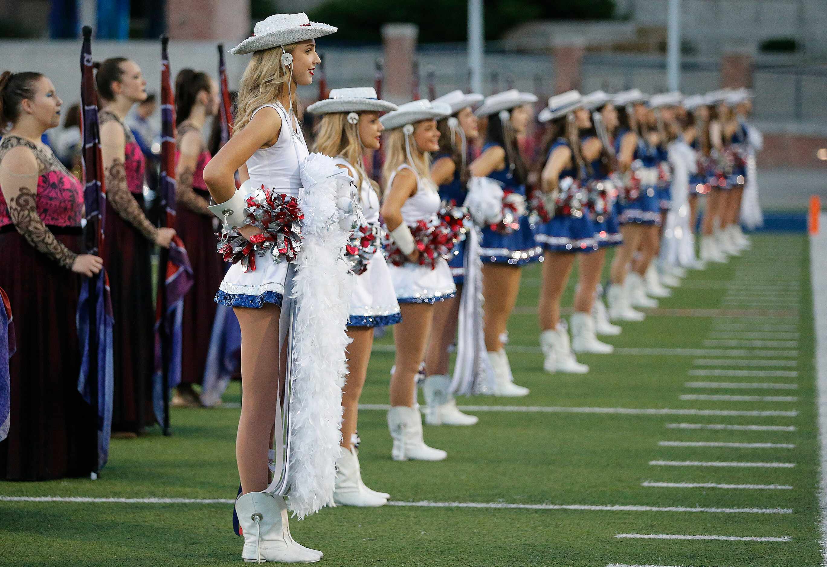 Willow Courtney, 17, with the Allen High School Tallenettes stands at attention wearing her...