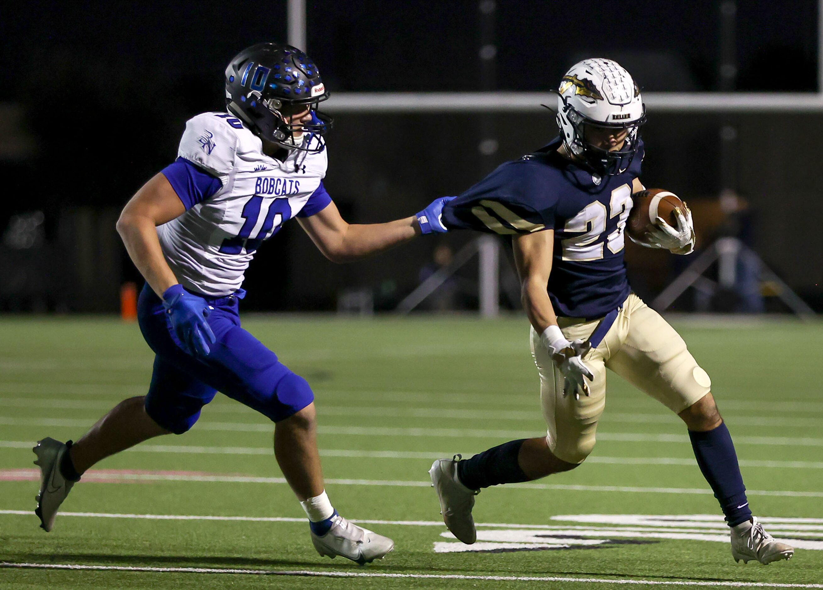 Byron Nelson linebacker William Scullin (10) grabs the jersey of Keller running back Jackson...