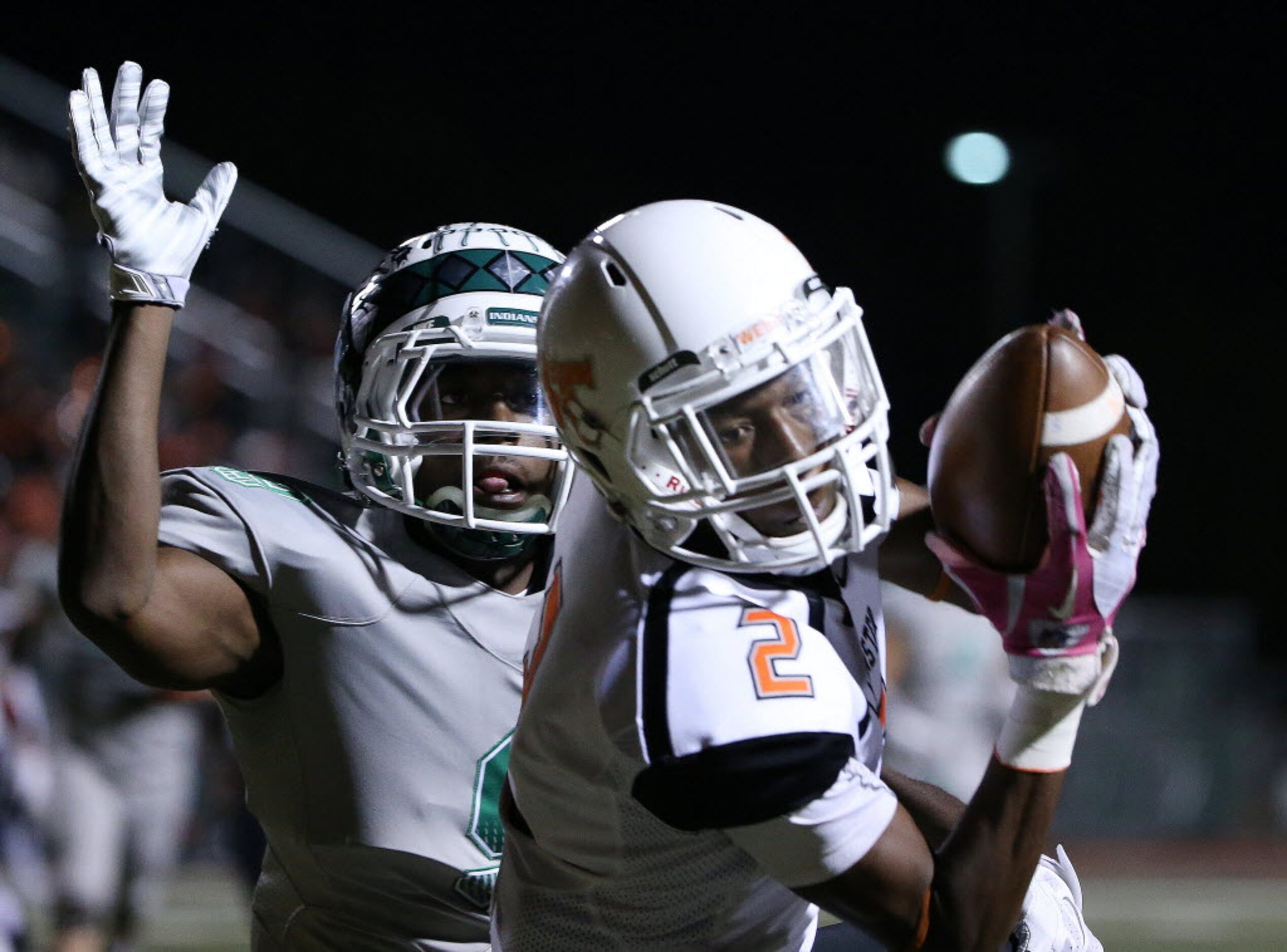 Lancaster wide receiver Cantrell Thomas (2) catching a pass for a touchdown over Waxahachie...