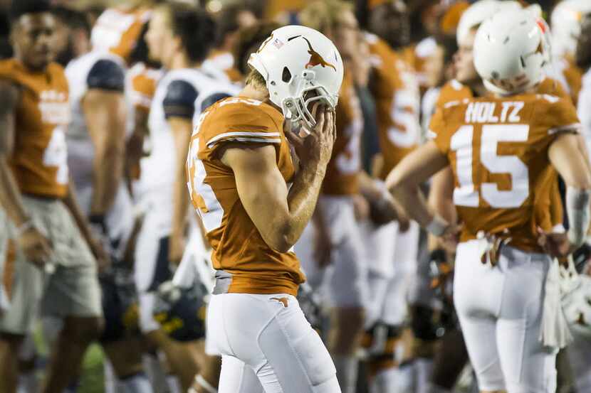 Texas place kicker Nick Rose (23) walks off the field after a loss to California in an NCAA...