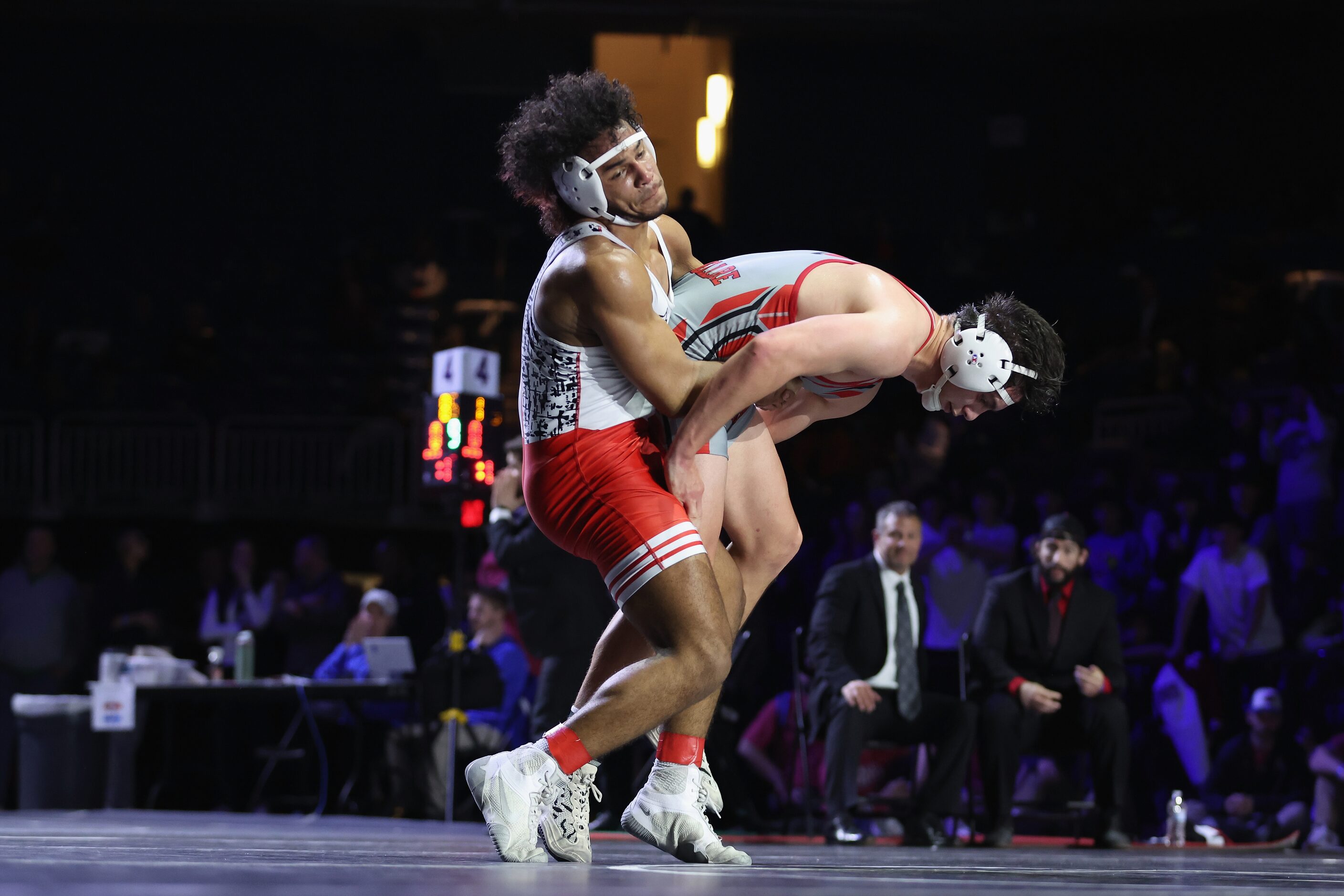 Ibraheem Ahmed of Arlington Martin (red) competes against Rocco Grazier of Houston Bellaire...