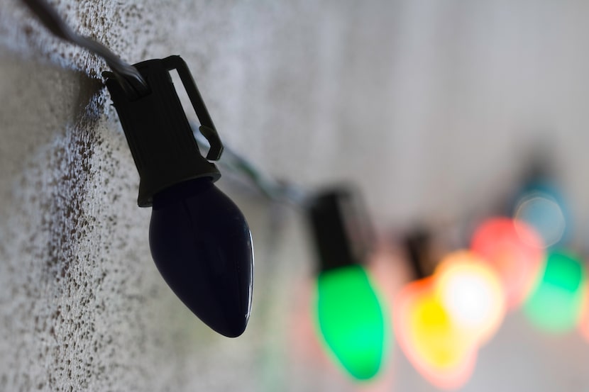 Dark bulb on strand of bright Christmas lights