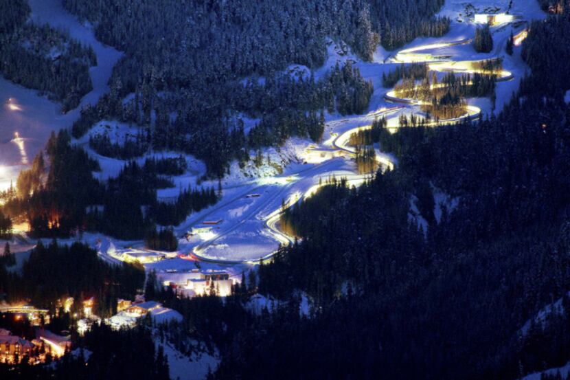 Lights glow around the Whistler Sliding Center track.  It's nearly a mile long, drops 499...