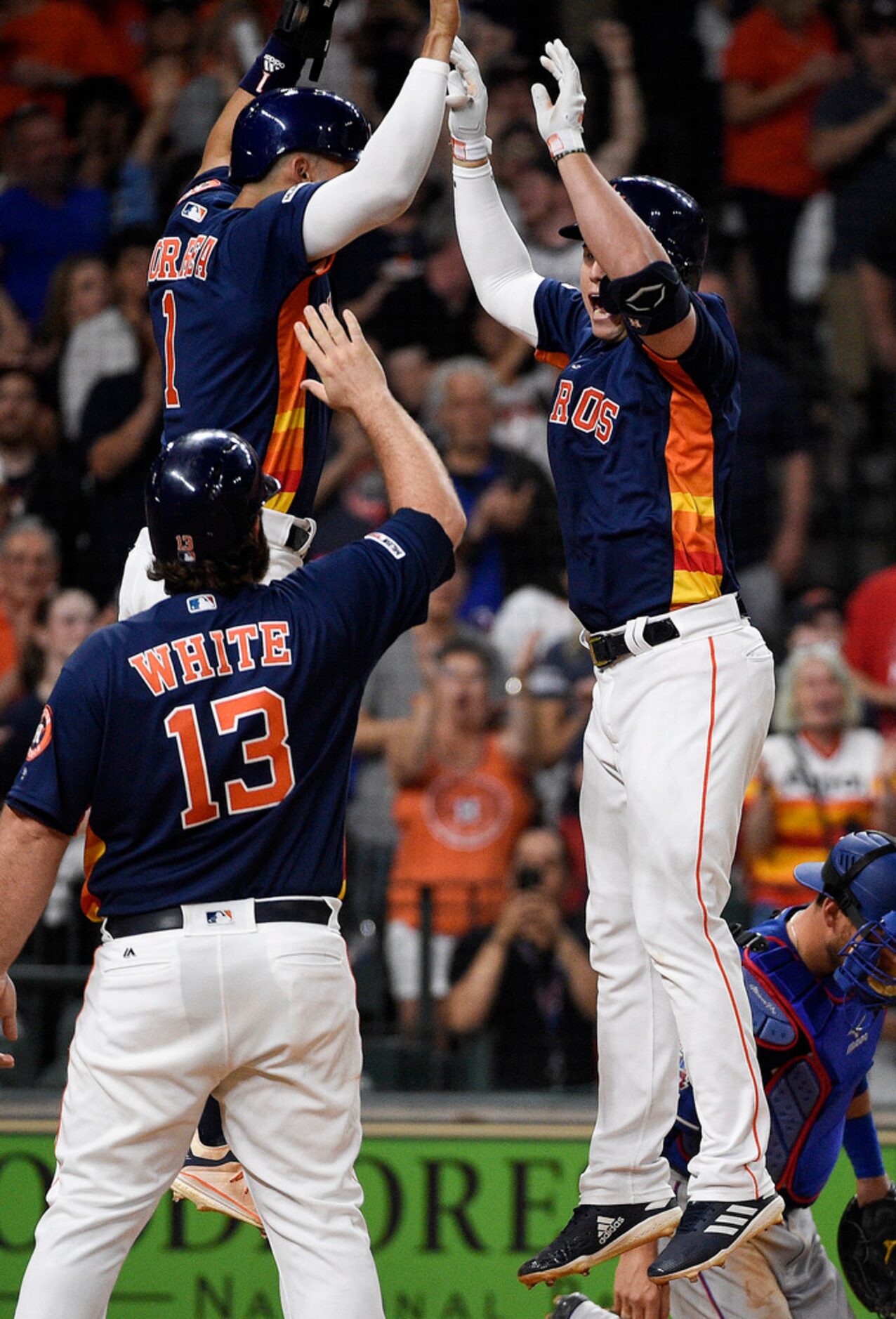 Houston Astros' Aledmys Diaz, right, celebrates his grand slam off Texas Rangers starting...