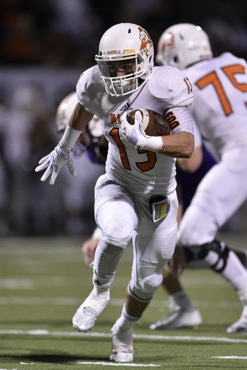 Aledo running back Caleb Primera (13) runs for a touchdown during a high school football...