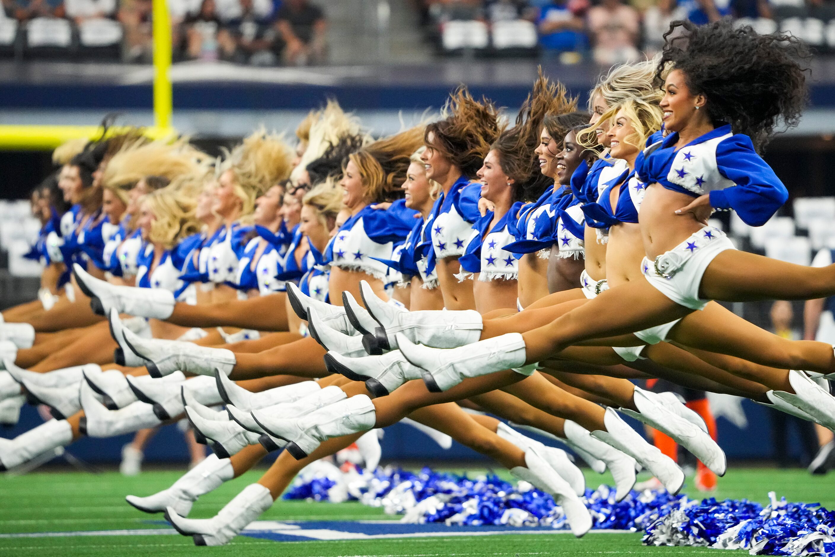 Dallas Cowboys cheerleaders perform before an NFL football game against the Cincinnati...